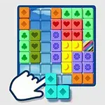 青いグリッド内に配置されたカラフルなタイルとブロック、画面下に手の形のアイコン。