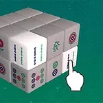 緑の背景に3×3の白い立方体ブロックが積み重ねられた画像で、ブロックには麻雀のような模様が描かれており、手のアイコンがそのうちの一つを指している。