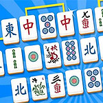 青い背景に並べられた麻雀牌のセット。