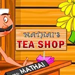 店主が立っている看板に「MATHAIS TEA SHOP」と書かれた木造の建物内の様子。