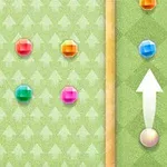 緑色の背景に色とりどりの宝石が配置され、矢印と穴が描かれている。