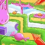 緑の迷路にピンクのゼリーやキャンディが散らばっているカラフルな風景。