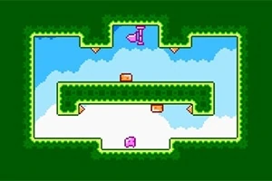 緑色の背景に囲まれた空の中に、ピンクとオレンジのブロックが配置されています。