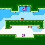 緑色の背景に囲まれた空の中に、ピンクとオレンジのブロックが配置されています。