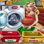 妊婦の女性が洗濯機の前に立ち、玩具と衣類用のカゴが床に置かれている。