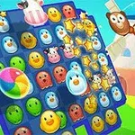 青と緑の背景に、さまざまな動物の顔とカラフルなボールが並んだゲーム盤が描かれています。