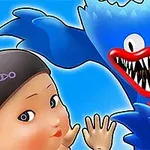 青い毛むくじゃらのキャラクターが、赤いリボンのような口の大きく開けた笑顔で、女性の人形と並んでいる。