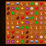 カラフルなアイコンが並んだグリッド、宝石、ハート、鍵、星、クローバー、月、花、キノコ、キャンディが描かれています。