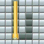 黄色の蛇のようなキャラクターが白と黒のタイルで構成されたグリッド上にいる画面。