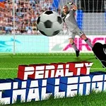 サッカーのゴール前でボールを蹴る選手とゴールキーパーが構えるシーン。