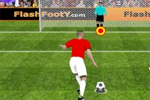 赤いシャツを着たサッカー選手がゴールキーパーに向かってペナルティキックをしようとしている場面。
