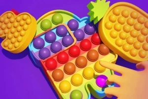 カラフルなポップイットのおもちゃを指で押している場面。