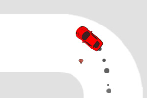 赤い車がカーブをドリフトしながら走行している様子。