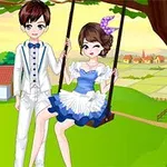 木のブランコに座っている白いスーツの男の子と青いドレスの女の子。