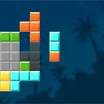 カラフルなブロックが積み重なっており、背景にヤシの木がシルエットで描かれた画像。