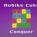 パープルの背景に、中央に4x4のカラフルなタイルが配置され、上部に「Rubiks Cube」、下部に「Conquer」という文字が表示されている画像。