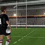 黒いユニフォームを着た選手がサッカースタジアムでボールを持ち、ゴールポストの方向を向いて立っている。