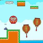青い空と雲を背景に、ジャンプするキャラクター、だるま、太鼓が描かれたピクセルアートスタイルのゲーム風景。