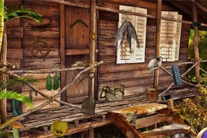木造の小屋の前に、釣り具やランタンなどの道具が掛けられている。