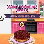 女性キャラクターが親指を立てている横に、キッチンのカウンターに置かれたチェリーケーキがある。