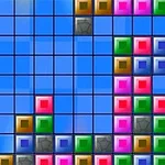 カラフルな四角形のブロックが青い背景のグリッドにランダムに配置されています。