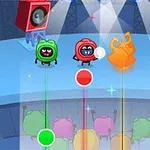 ステージ上で赤、緑、青のキャラクターが音楽に合わせてパフォーマンスをしている様子。
