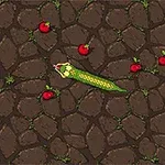 緑色のヘビが石畳の上をスライドし、赤いリンゴが散らばっている。