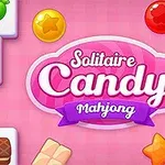 ピンクの背景にキャンディやアイスクリームの絵柄が描かれた麻雀タイルが並んでいます。