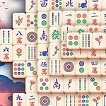 麻雀牌が並べられた風景に、招き猫と赤い屋根の塔がある。