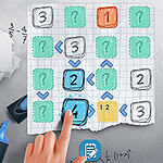 方眼紙上に数字と矢印が描かれ、手が指し示している様子と計算機が置かれている。