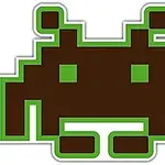 緑色のピクセルで縁取られた茶色のエイリアン風のキャラクターが描かれています。