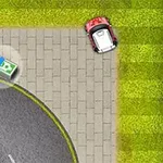 芝生の隣の舗装された道に小さな赤い車があり、近くに紙幣の束がある風景。