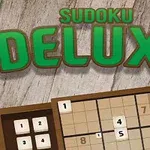 緑色の文字で「DE LUXE」と書かれているロゴの下に、数独パズルが表示された木目調の背景。