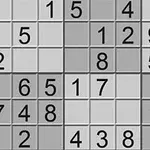数字が書かれたグリッドパズルの一部で、異なる濃淡のグレーのマス目が並んでいる。