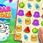 キャラクターがパズルゲームのアイコンとカラフルなフルーツやアイテムが並んだグリッドを指で指している。