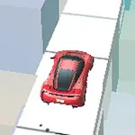 赤い車が白い道路を走っている。