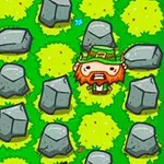 緑の草地に置かれた岩の間に立つ赤いひげのキャラクター。