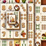 数字や植物、収穫祭をテーマにした絵が描かれたタイルが並んでいる画像。