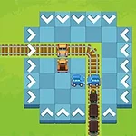 青いタイルの上に配置された線路に沿ってトラックが走る様子。
