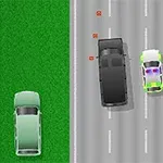 道路の上を黒い車と白と緑のパトカーが走行している。