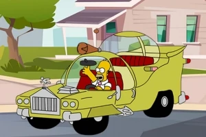 緑色の奇抜なデザインの車を運転する黄色いキャラクター。