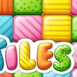 カラフルで模様があるタイルの背景に「TILES」と書かれた文字。