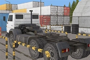 白いトラックのヘッドがコンテナヤードに駐車されている。