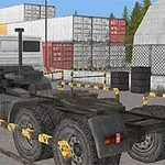 白いトラックのヘッドがコンテナヤードに駐車されている。