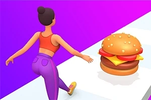 髪をお団子にまとめた女性が、床に置かれたハンバーガーに向かって歩いている。