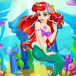 赤い髪の人魚がカラフルな海底の背景の前に座っているイラスト。
