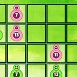 緑とピンクの円に数字が描かれた緑の背景に、グリッドが配置されています。