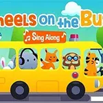 黄色いバスに乗った動物キャラクターたちと「Wheels on the Bus」「Sing Along」の文字。