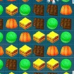 お菓子やスイーツのピースがグリッド状に並んでいるパズルボード。