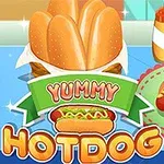 テーブルの上に並んだホットドッグと調味料の瓶、色鮮やかな「YUMMY HOTDOG」の文字。